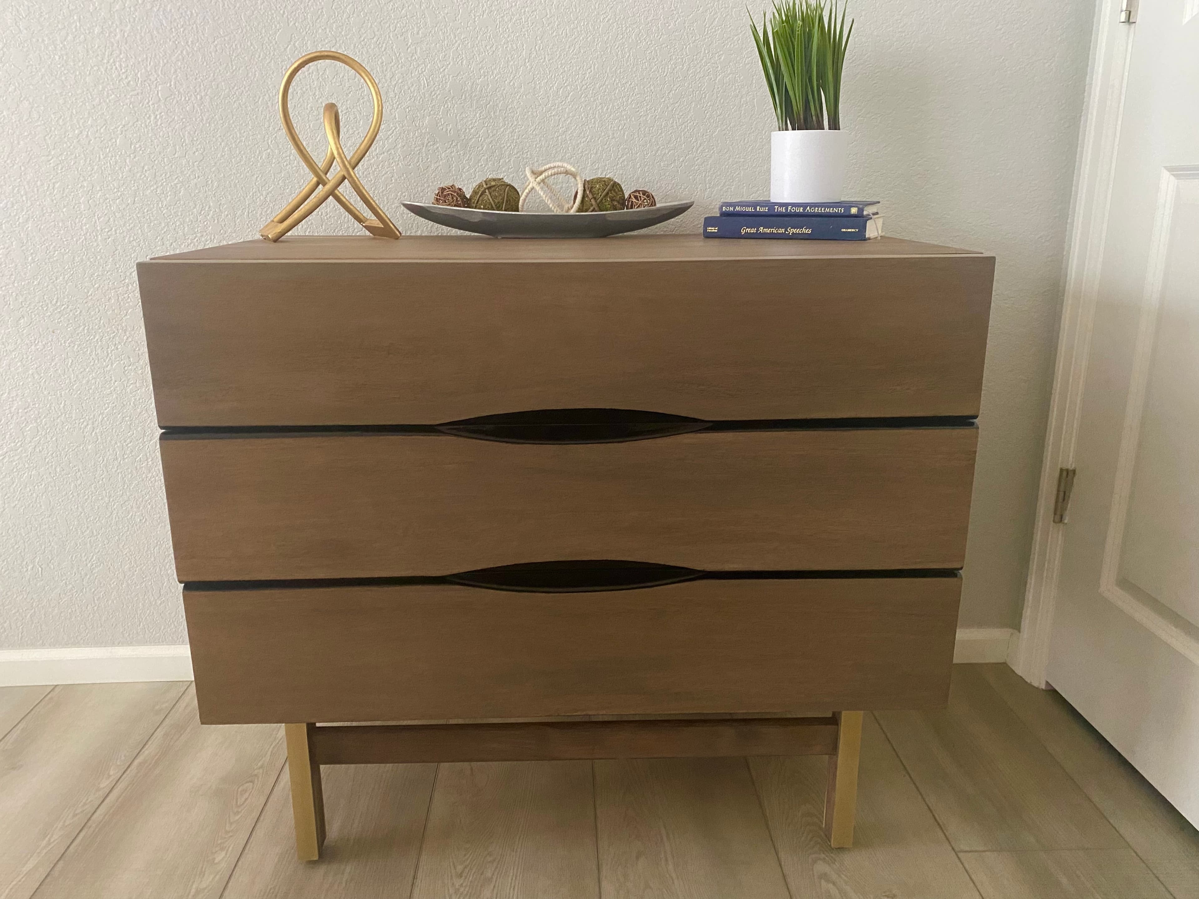 Front view of a real walnut dresser finished by Studio Alder.