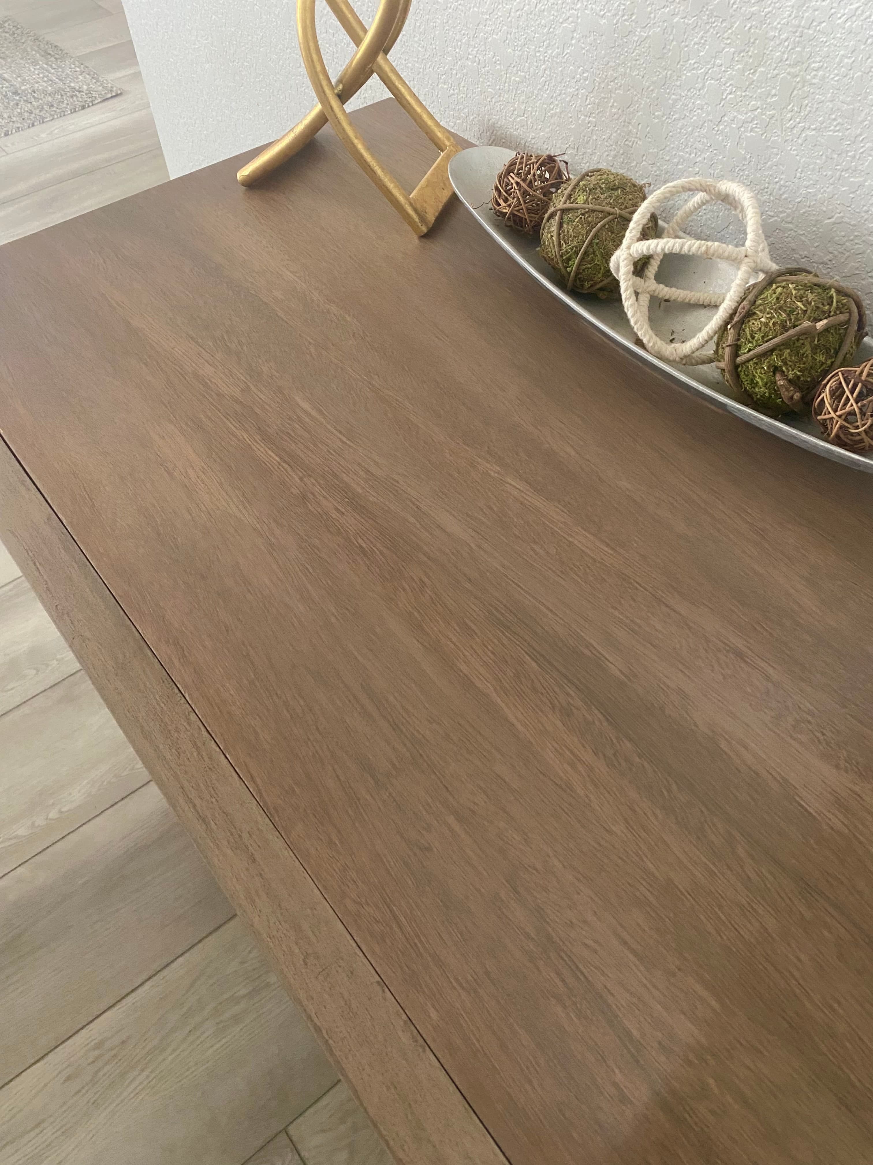 Close detail of the restored walnut dresser top and grain.