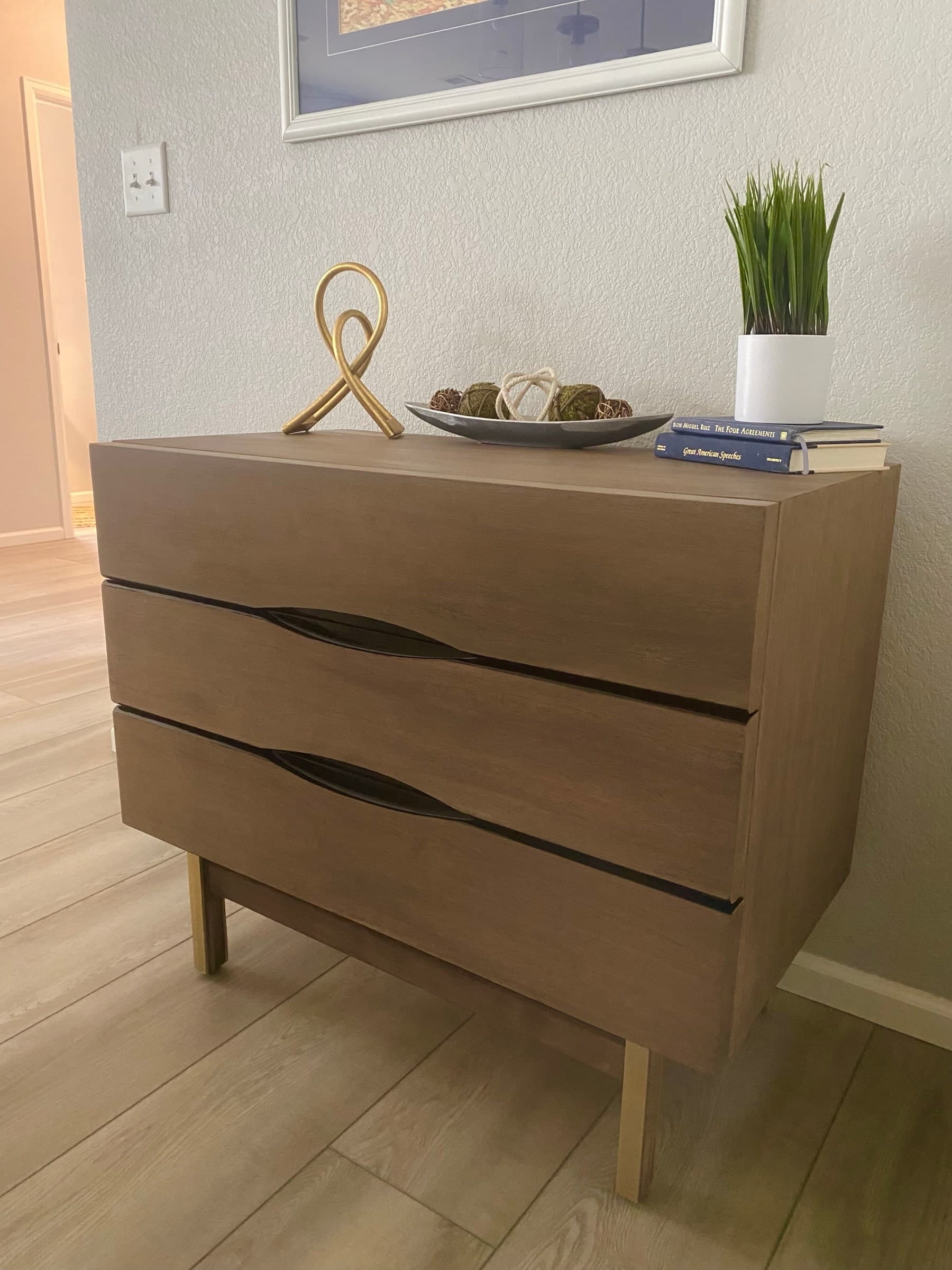 Studio Alder walnut dresser shown in a quiet room setting.